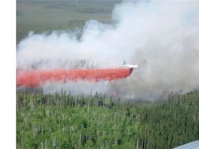 A forest fire burns in the La Ronge area, one of 116 fires burning in Saskatchewan this week. Some 1,100 evacuees from the north are staying in shelters in Regina.