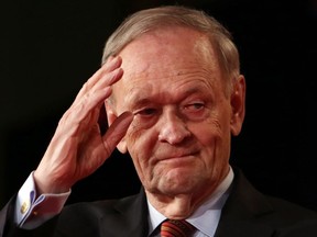 Former prime minister Jean Chretien salutes after addressing the Liberal Party leadership in Ottawa, Sunday April 14, 2013.