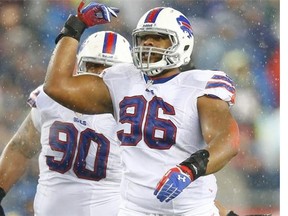 Former University of Regina Rams defensive lineman Stefan Charles, now of the Buffalo Bills, reacts following a sack of New England Patriots quarterback Tom Brady in 2013.