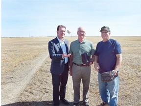 From left, Regina Mayor Michael Fougere, director of Pacers Baseball Jim Fink, and Pacers president Tony Kuffner stand in a field that will be the new Pacer Park northeast of the existing ball diamonds off Tower Road on Sept. 11, 2015.  (DON HEALY/Regina Leader-Post)