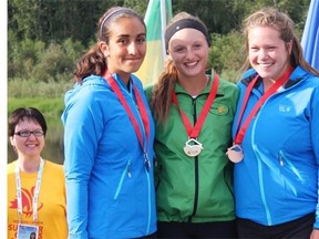 Gold medalist Lexy Vincent of Saskatchewan poses with Albertans Jane Girgulis and Jenaya Victoria Fabrizi from the women’s K-1 1000 metre medal ceremony in Fort McMurray Alta. on Saturday August 8, 2015.