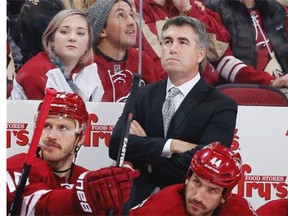 Head coach Dave Tippett of the Arizona Coyotes reacts on the bench during the NHL game against the Colorado Avalanche at Gila River Arena on November 25, 2014 in Glendale, Arizona.