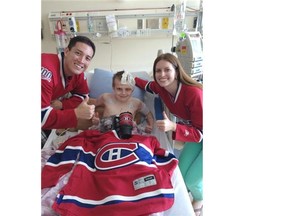 Rob Hing and his wife Alayne visit 13-year-old Alex Smidt, who is battling meningitis, at the Alberta Children’s Hospital in Calgary. Smidt’s story touched Habs fans on The Gazette’s hockeyinsideout.com website, resulting in Hing and his wife deciding to visit the boy from Regina they had never met and bring him some Habs goodies to help cheer him up.