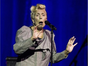 Joni Mitchell sings of three songs on stage in Toronto on Tuesday at her 70th birthday tribute concert, which was part of the Luminato arts festival.