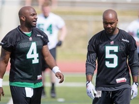 Kevin Glenn (5) has Darian Durant’s back with the Roughriders.