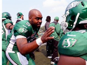 Kevin Glenn, left, shown talking Sunday with offensive tackle Xavier Fulton during a CFL game against the Toronto Argonauts, has quickly made a positive impression with the Saskatchewan Roughriders.