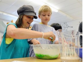 Kristen Hill with her son Michael, 7, making puffy paint at the Early Years Family Centre.