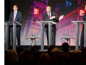 Liberal leader Justin Trudeau, left, New Democratic leader Thomas Mulcair, centre, and Prime Minister Stephen Harper, during the Globe and Mail Leader’s Debate 2015 in Calgary, on September 17, 2015.