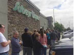 A line formed outside the Sobeys Liquor store, Regina’s newest private liquor store, during its opening day on Friday. People started waiting for the store to open at 9 a.m. Photo by Austin M. Davis/LEADER-POST