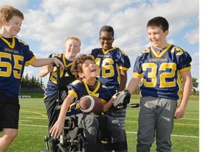 Logan Tonge, center, laughs with his friends Reid Sulymka, Brady Calvert, Zane Willness, and Kyle Phillipson (from left) at Leibel Field in Regina, Sask. on Tuesday Sept. 29, 2015.