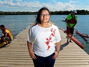 Lushani Nanayakkara stands on the dock at Wascana Lake in Regina on Saturday August 1, 2015. The PhD student is conducting surveys and studying how Saskatchewanians use lakes.