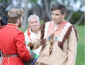 Major James Walsh (left, portrayed by Jordan Svenkeson) speaks to Tatanka Iotaka (right, portrayed by Colin Dingwall) during a performance of Spirits of the Trail at the RCMP Heritage Centre in Regina on Saturday August 8, 2015. Events from the 1877 encounter between Sioux tribes fleeing the U.S. army and the RCMP is the focus of the play.