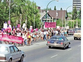 Marchers taking part in Regina's first gay pride parade walk across the Albert St. bridge on June 23, 1990.