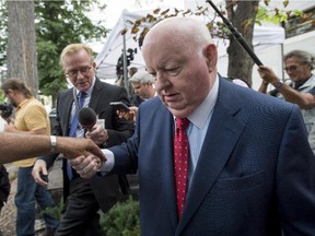 Sen. Mike Duffy, a former Conservative caucus member, leaves the courthouse in Ottawa following the second day of testimony by Chris Woodcock, former director of issues management in the Prime Minister's Office, on Tuesday, Aug. 25, 2015. The trial is expected to break until November.