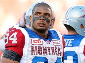 Montreal Alouettes’ Michael Sam and teammates warm up for a Canadian Football League game against the Ottawa Redblacks in Ottawa, Ontario. Sam is stepping away from pro football. Sam, the first openly gay player drafted by the NFL, has told the Alouettes that he is leaving the team. He tweeted Friday, Aug. 14, that “The last 12 months have been very difficult for me, to the point where I became concerned with my mental health. Because of this I am going to step away from the game at this time.”