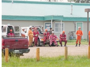 Firefighters on break in forest fire fighting at Montreal Lake on Thursday, July 9th, 2015.