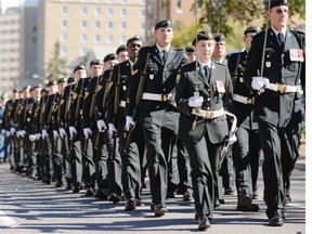 Numerous military units march along Victoria St. toward city hall during Freedom of the City parade in Regina, Sask. on Saturday Sep. 12, 2015.