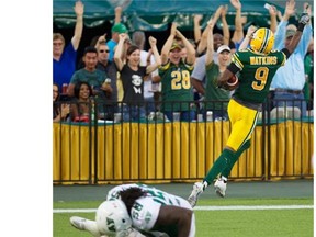 Patrick Watkins (9) of the Edmonton Eskimos celebrates his touchdown against the Saskatchewan Roughriders during second half CFL action in Edmonton, Alta., on Friday July 31, 2015.