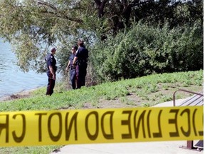 Police cordoned off an area of shoreline near Wascana Lake after a body was spotted near the shore on August 10, 2015. Police have concluded their investigation after identifying the deceased and deemed the case not criminal. (BRYAN SCHLOSSER/Leader-Post)