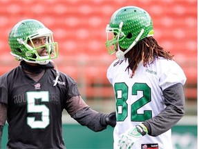 Quarterback Kevin Glenn (5) and receiver Naaman Roosevelt (82) talk during a recent practice with the Riders (BRYAN SCHLOSSER/Regina Leader-Post)