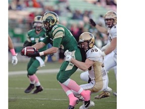 Rams running back Atlee Simon (#36) is tackled by Manitoba Bisons defensive back Eric Plett (#35) during a game held at Mosaic Stadium in Regina, Sask. on Saturday Oct. 17, 2015. (Michael Bell/Regina Leader-Post)