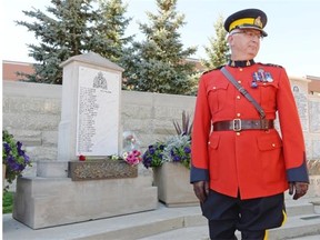 RCMP assistant commissioner Joe Oliver turns away from the cenotaph at the National Memorial Service held at Depot Division in Regina, Sask. on Sunday Sep. 13, 2015. Oliver's son Adrian, a constable in the RCMP, died in 2012. (Michael Bell/Regina Leader-Post)