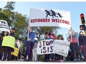 The Refugees Welcome rally at the corner of Victoria Avenue at Scarth Street in Regina on September 8, 2015 called on the federal government to overhaul Canadian immigration and refugee policies.