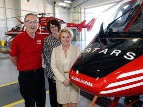 Rod Gantefoer, STARS Executive Director, Saskatchewan, Bonnie Monteith, communications lead, and Andrea Robertson, President and CEO, with STARS Shock Trauma Air Rescue Society at the STARS Hangar in Regina, August 19, 2015.