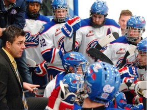 Regina Pat Canadians head coach Brad Herauf (left) gives instruction to his team during a game held at the Co-operators Centre in Regina on Sunday Dec. 21, 2014. (Michael Bell/Regina Leader-Post)