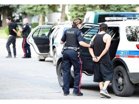 Regina city police made multiple arrests on Bond Street and 11th Avenue following a fight on Tuesday afternoon. (DON HEALY/Regina Leader-Post)