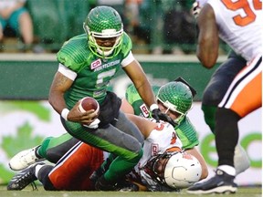 Saskatchewan Roughriders quarterback Kevin Glenn (#5) gets sacked by BC Lions defensive lineman Craig Roh (#93) during first half CFL action at Mosaic Stadium in Regina on Friday.