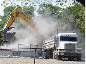 REGINA, SK :  July 16, 2015  --  Silverado Demolition works on tearing down a former school on the 1900 block of Retallack Street in Regina on Thursday. 
 TROY FLEECE / Regina Leader-Post