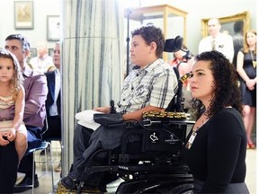 REGINA, SK: JUNE 22, 2015 — Citizen Consultation Team member Andrea Lavallee (R) along with her son, Maxime 10 years (C) and her husband Terrence and daughter Genvieve (L) from Meadow Lake, SK at a news conference at the Legislative building in Regina on June 22, 2015 regarding the Gov’t of Saskatchewan’s Disability Strategy, entitled People Before Systems: Transforming the Experience of Disability.   (DON HEALY/Regina, Leader-Post) (Story by Emma Graney) (NEWS)