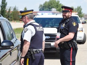 RCMP Sgt. Pete Garvey (L) and  Cst. Dave Connell (R) with the Saskatoon police service do a training traffic stop the RCMP Academy in Regina in regards to the Combined Traffic Services Saskatchewan news conference in Regina June 10, 2015.