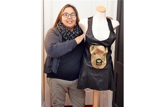 Joely Big Eagle-Kequahtooway with some of her designs at the Tatanka Boutique in Regina on October 21, 2015. Black Italian leather with golden Buffalo face appliquÈ dress tank top. Big Eagle-Kequahtooway is one of the local designers showing at the Fashion Speaks indigenous fashion show on Saturday.