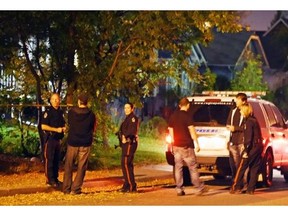 Regina police service members investigate a shooting on the 2100 block of Queen Street in Regina at approximately 9pm in Regina on October 1, 2015.