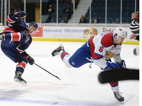 Regina Pats right-winger Lane Zablocki, 39, goes for a spill after being hit by the Edmonton Oil Kings' Chance Patterson on Sunday at the Brandt Centre. Patterson was penalized for kneeing and the Pats scored on the ensuing power play. 
  
  
 Michael Bell/Leader-Post