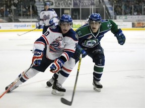 egina Pats forward Adam Brooks' (#10) is followed by Swift Current Broncos forward Tyler Steenbergen (#17) during the second period of a game held at the Brandt Centre in Regina on Sunday Dec. 28, 2014.