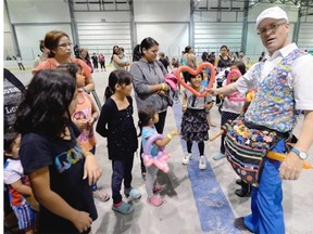 Warren Johnson and his balloons were a big hit with the kids at a carnival put on for fire evacuees at Evraz Place Thursday in Regina July 8, 2015.