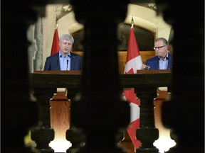 Prime Minister Stephen Harper, left, and Saskatchewan Premier Brad Wall hold a news conference at the  Legislative Building in Regina.