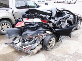 The remains of the Honda Accord that Steve Nicklin and his wife Vicky were in the rear seats of. The car was struck by a Ford truck being driven by Justin Hodel on the Trans-Canada Bypass on June 20, 2010. Steve Nicklin died shortly after the crash.