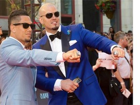 Ricky Foley, right, and Toronto Argonauts teammate Chad Owens pose on the red carpet June 21 at the Much Music Video Awards in Toronto. 
  
  
 Nathan Denette/The Canadian Press files