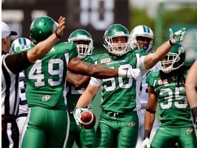 Riders linebacker Jake Doughty (50) celebrates his first CFL interception on Sunday against the Toronto Argonauts (Michael Bell/Leader-Post files)