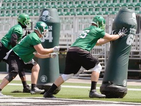 The Roughriders’ defensive line works on their technique during a recent practice (Bryan Schlosser/Leader-Post)