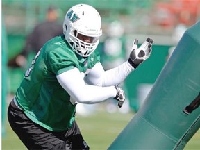 Roughriders defensive tackle Tearrius George works with a tackling dummy during Thursday’s practice (TROY FLEECE/Regina Leader-Post)

REGINA, SK :  September 10, 2015  --  Saskatchewan Roughriders Tearrius George at practice at Mosaic Stadium in Regina on Thursday. 
 TROY FLEECE/Regina Leader-Post