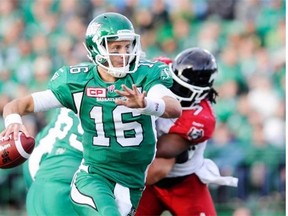 Roughriders quarterback Brett Smith looks for an opening against the Stampeders on SaturdAY (THE CANADIAN PRESS/Mark Taylor)