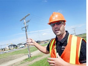 Ryan Blair, manager of operations and maintenance for Pasqua area with SaskPower, talks about one of the 72,000 volt transformers located at a SaskPower substation on Wood Crescent in Regina June 12, 2015.