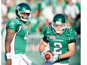 Ryan Smith, right, celebrates his first CFL touchdown Saturday alongside quarterback Darian Durant, who connected with the second-year Saskatchewan Roughriders receiver on a 53-yard scoring bomb. 
  
 Michael Bell/Leader-Post files.