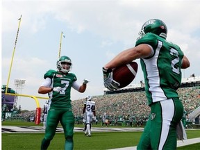 Ryan Smith, right, shown celebrating a touchdown Sunday with fellow North Dakota-born receiver Weston Dressler, was placed on the six-game injured list Friday (Michael Bell/Leader-Post files)