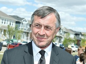 Saskatchewan Education Minister Don Morgan talks about the building of three new joint-use schools at the corner of Ambulet Drive and James Hill Road in Regina on June 15, 2015.